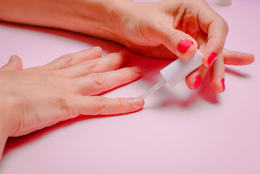 Close-up of a woman's hand while taking care of her nails