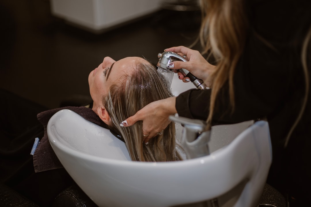 Professional hairstylist working with a client in a salon